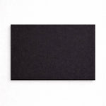 Black rectangular mat on a white background